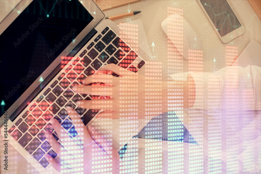 Poster double exposure of woman hands working on computer and forex chart hologram drawing. top view. finan