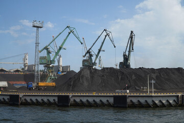 Fototapeta na wymiar Platforms for loading coal on platforms in the port of Gdansk on the river Marwta Wisla. Poland 