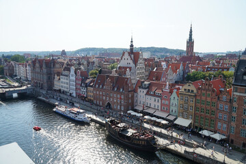 Obraz premium Houses on the birch of the river Marvta Wisla in Gdansk. Poland 