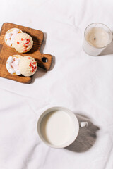 Cocoa bomb in the cup with marshmallows, chocolate hot melts when hot milk is added for creating a trendy tasty drink. 
