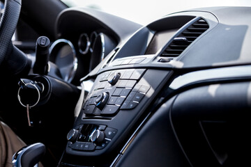 Fototapeta na wymiar Brand new car interior with dashboard