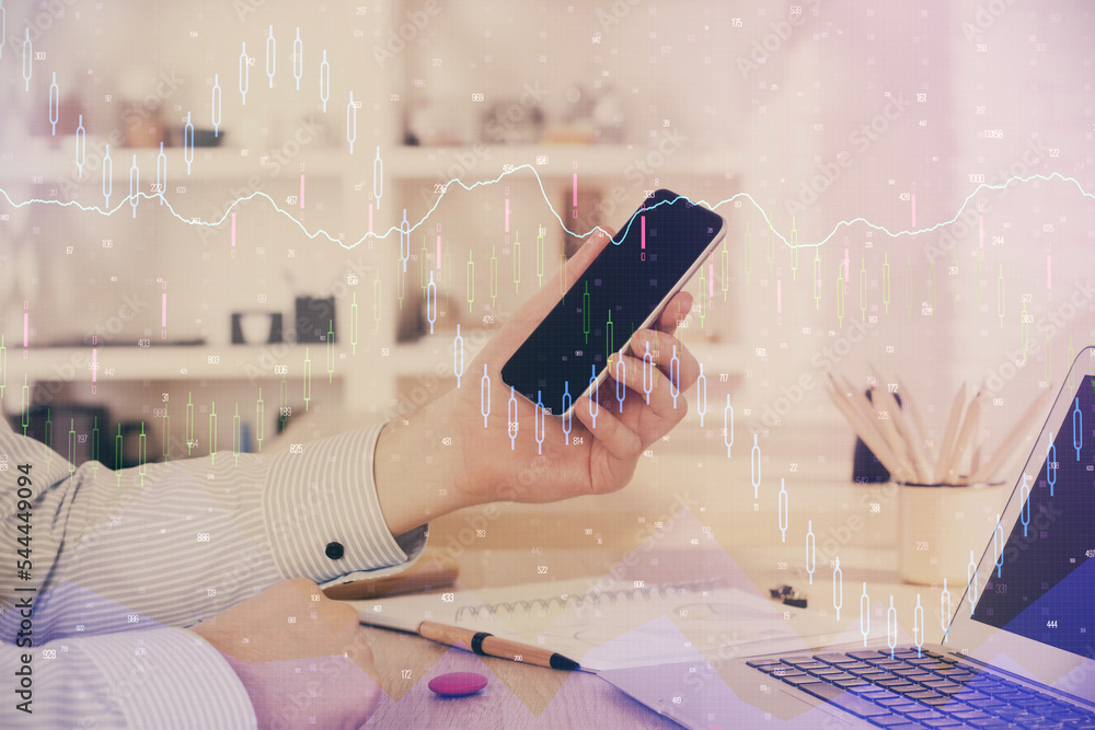 Poster double exposure of man's hands holding and using a digital device and forex graph drawing. financial