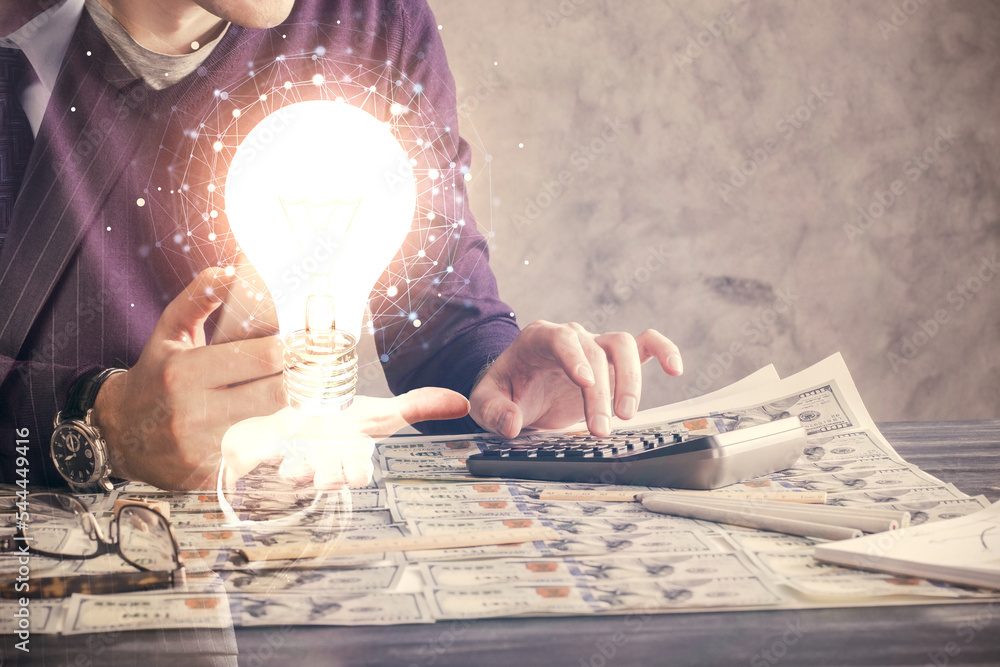 Poster Double exposure of man's hands holding and using a digital device and bulb hologram drawing. Idea concept.