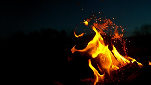 Super slow motion of campfire placed on a meadow. Filmed on high speed cinema camera.