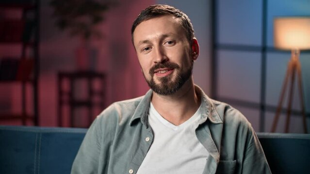 Friendly guy video blogger vlogger talking greeting explaining communication shooting media content