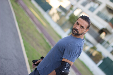 Portrait of handsome bearded man in casual clothes. Mid adult sportsman in casual clothes and...