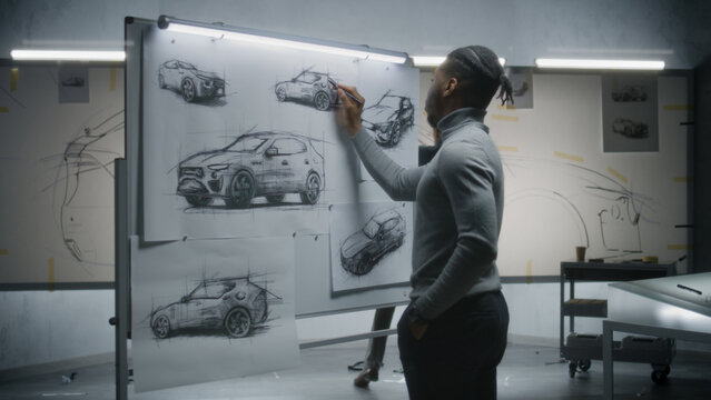 Two Diverse Automotive Male Designers Drawing Sketches With Marker On Whiteboards, Developing Futuristic Electric Car Design. They Working In Modern Car Design Development Studio.