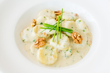Cheese gnocchi with blue cheese sauce and garlic