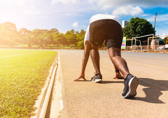 Asian young athlete sport runner black man active ready to start running training at the outdoor on...
