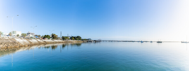 Tauranga downtown waterfront as sunrises from east or right side of image - obrazy, fototapety, plakaty