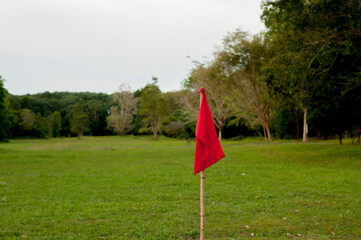 red flag on green golf course
