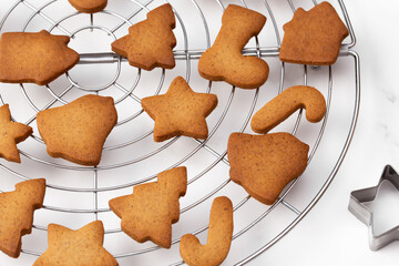 Christmas gingerbread cookies in different shapes on a white background