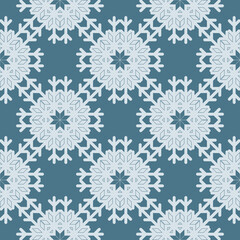 Geometric seamless snowflake texture on blue background. Elegant monochrome vector pattern for home decor, Christmas and New Year backgrounds, invitations and paper packaging.