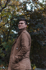 Portrait of a man in the park in autumn