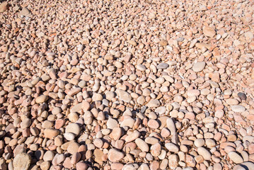 Texture di sassi rotondi in Sardegna.