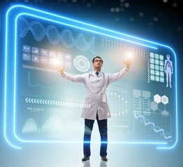 Doctor in futuristic medical concept pressing button