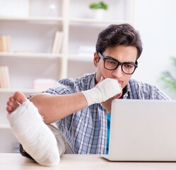 Freelancer with foot injury working from home