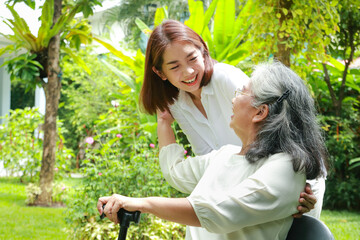 Family concept. daughter taking care of elderly mother at home They both smiled happily in the...