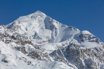 Tetnuldi mountain slope covered with snow and glaciers, Caucasus Mountains, mountaineering in Georgia