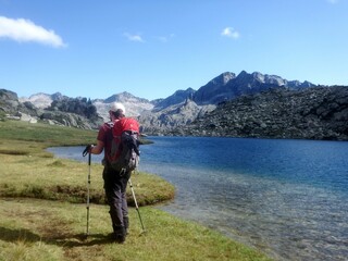 Fototapeta na wymiar Pyrenees, Carros de Foc hiking tour. A week long hike from hut to hut on a natural scenery with lakes, mountains and amazing flora and fauna. 