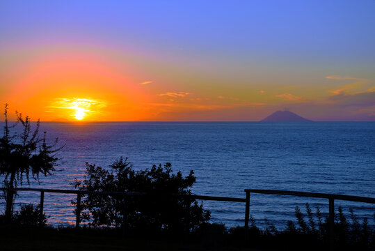 sunset of the volcano Stromboli seen from capo vaticano italy