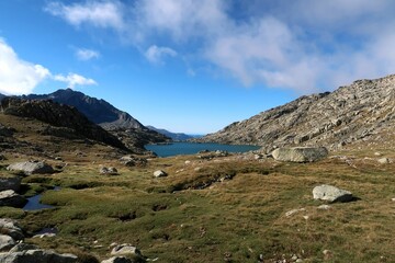 Fototapeta premium Pyrenees, Carros de Foc hiking tour. A week long hike from hut to hut on a natural scenery with lakes, mountains and amazing flora and fauna. 