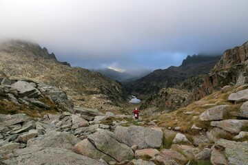 Obraz premium Pyrenees, Carros de Foc hiking tour. A week long hike from hut to hut on a natural scenery with lakes, mountains and amazing flora and fauna. 