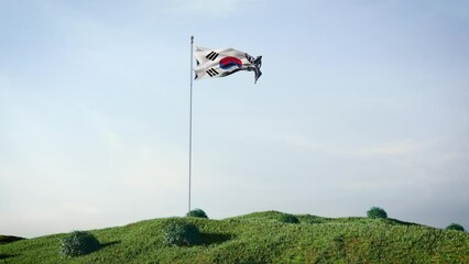 South Korea flag waving in the wind on a beautiful landscape. Blue sky. 4K HD. Stunning image.