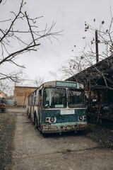 old rusty abandoned Soviet trolleybus. abandoned passenger transport. vertically, selective focus
