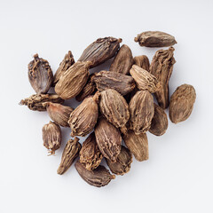 barrel dried black cardamom on a white background