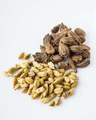 barrel dried black cardamom on a white background