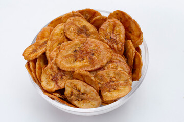 Banana chips on white background