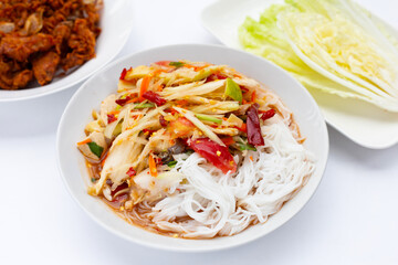 Spicy green papaya salad with vermicelli.