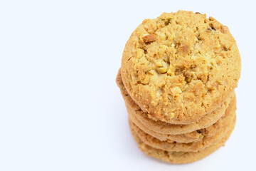 Pistachio and almond cookies on white background.