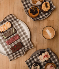 coffee, slice and cakes on a table