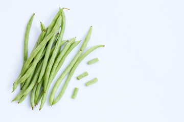Green beans on white background.