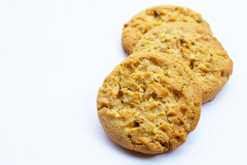 Pistachio and almond cookies on white background.