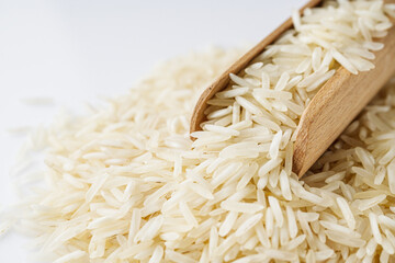 raw basmati rice on a white acrylic background