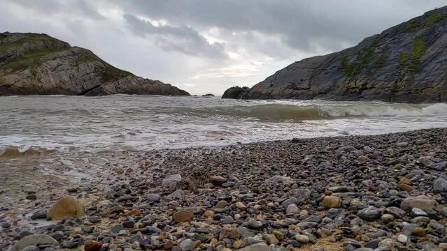 Slow Motion Sea Waves Crashing in on Small Bay in Mumbles UK