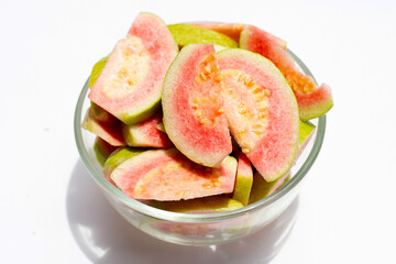 Fresh pink guava on white background.