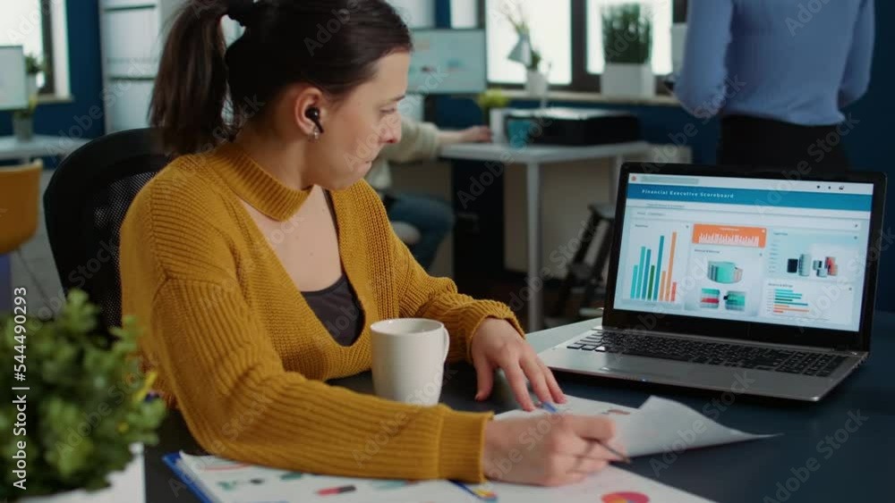 Poster portrait of startup employee analyzing financial data comparing paper with charts with statistics on