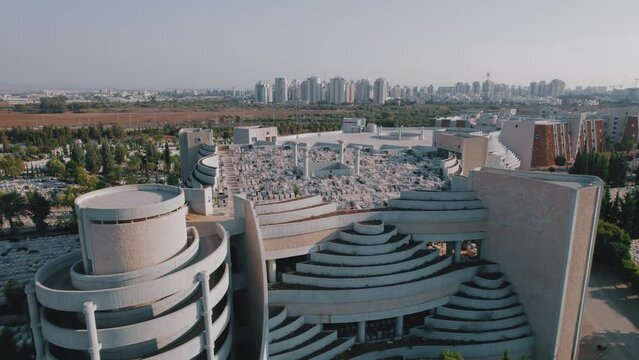 Modern cemetery with one-story burial building - Vertical Cemetery Aerial footage parallax shot #025