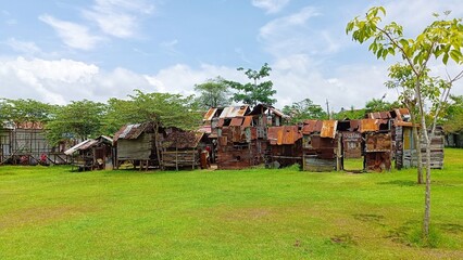  Indonesian slum house in green field