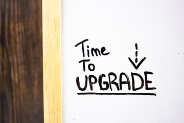 TIME TO UPGRADE - text concept by marker on blackboard. Software upgrade concept text.