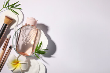 Flat lay composition with micellar water on white background. Space for text