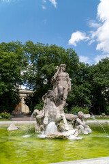 Fototapeta na wymiar Munich fountain in the park statue 