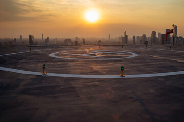The Heli Copter parking lot on the deck at sunset in the capital of Thailand. Space for helicopter...