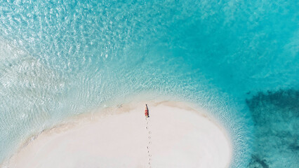 Lying on a sand bar - the Bahamas
