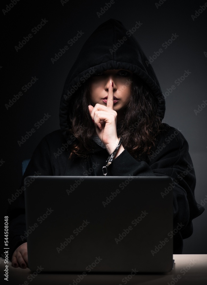 Poster female hacker hacking security firewall late in office