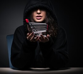 Female hacker hacking security firewall late in office